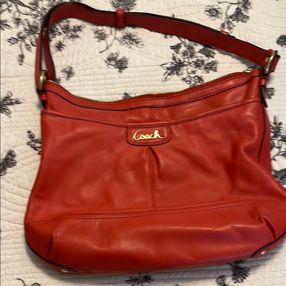 Coach Orange/Red Leather Shoulder Bag with Gold Accents with adjustable strap